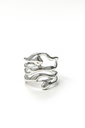 organic open silver ring with sculptural branch-like design on white studio background