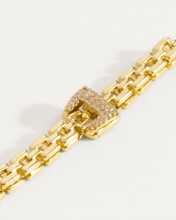 Gold-plated regal link buckle bracelet close-up, modern minimalist jewelry style