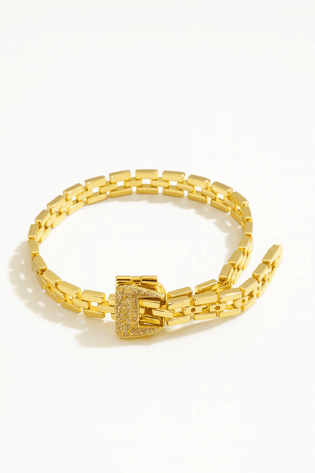 Gold-plated regal link buckle bracelet close-up, modern minimalist jewelry style