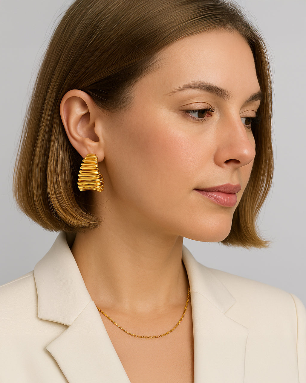 Bold gold hoop earrings with ribbed sculptural texture – Ribbed Radiance Hoops by Jadejuri
