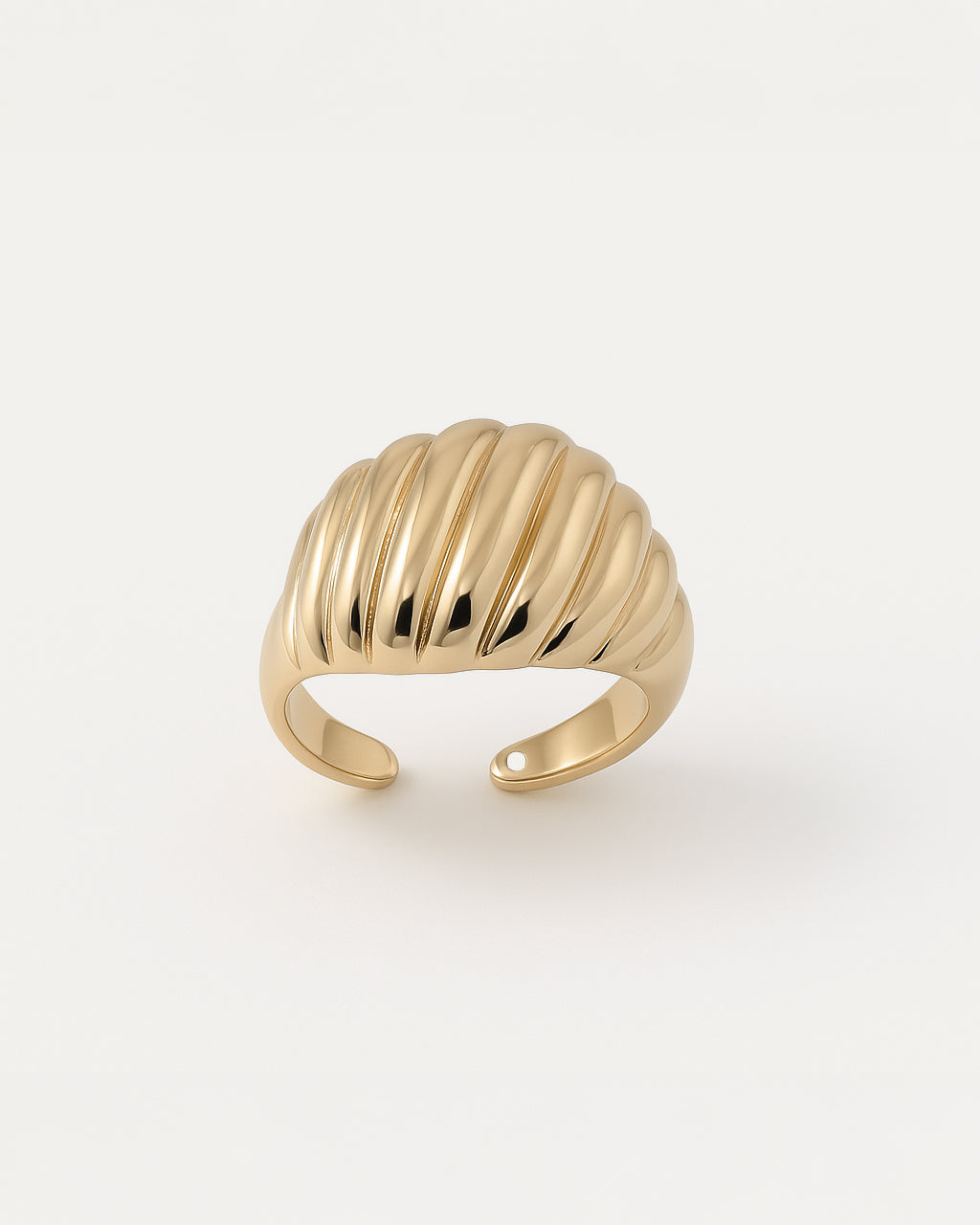 Gold statement ring with smooth sculpted ridges and dome-like shell design