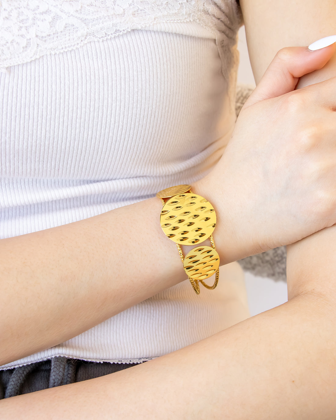 Ripple Gleam Cuff Bracelet in hammered gold finish on wrist – Jadejuri