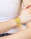 Ripple Gleam Cuff Bracelet in hammered gold finish on wrist – Jadejuri