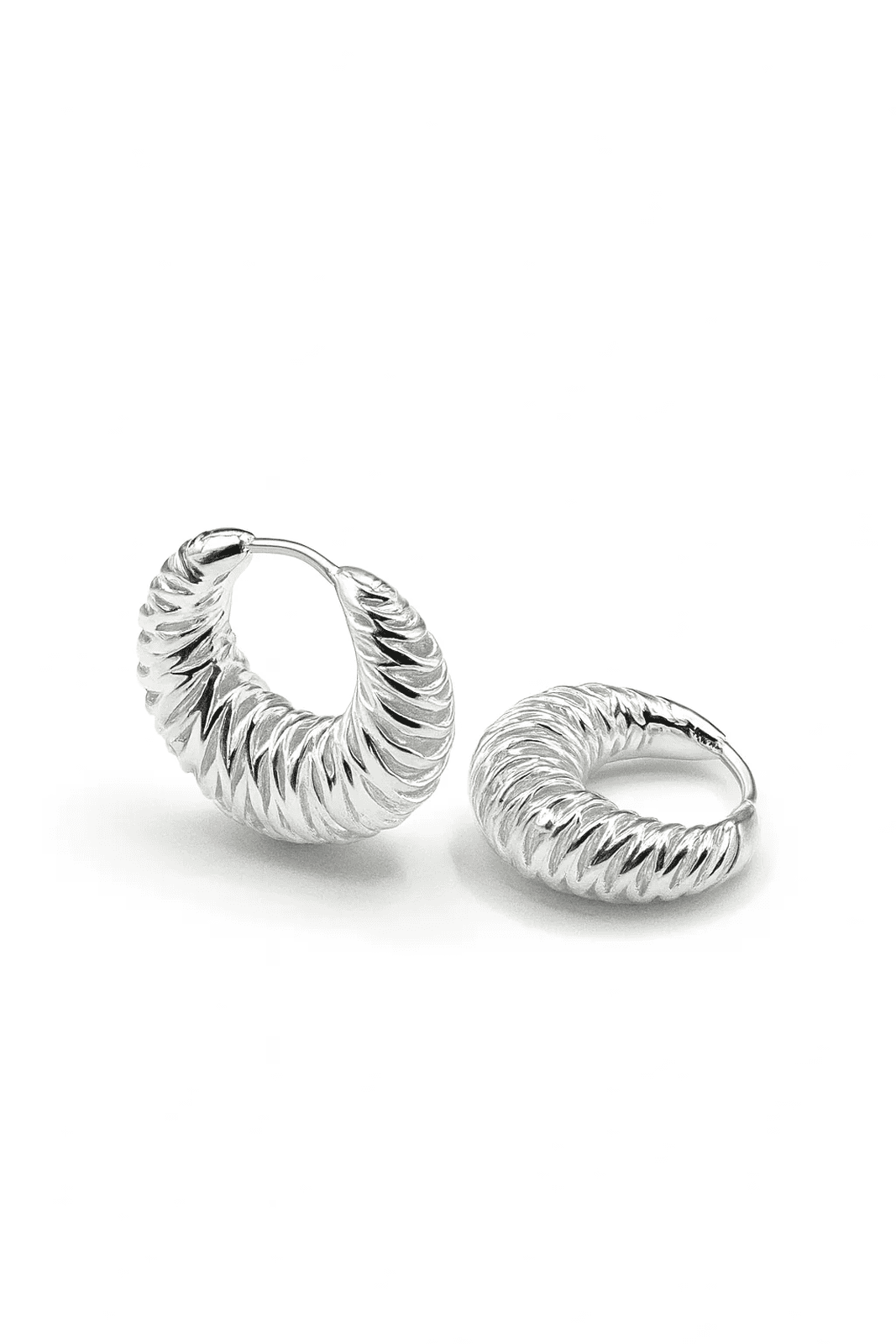 Silver hoop earrings on a white background