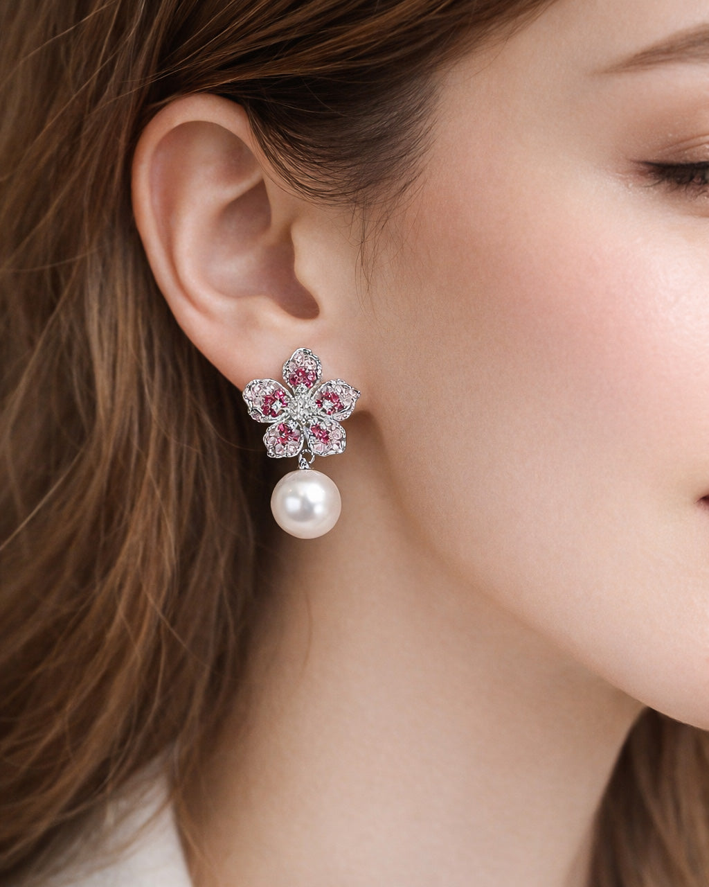 Rose flora pearl drop earrings with pink zircon silver plated worn on ear
