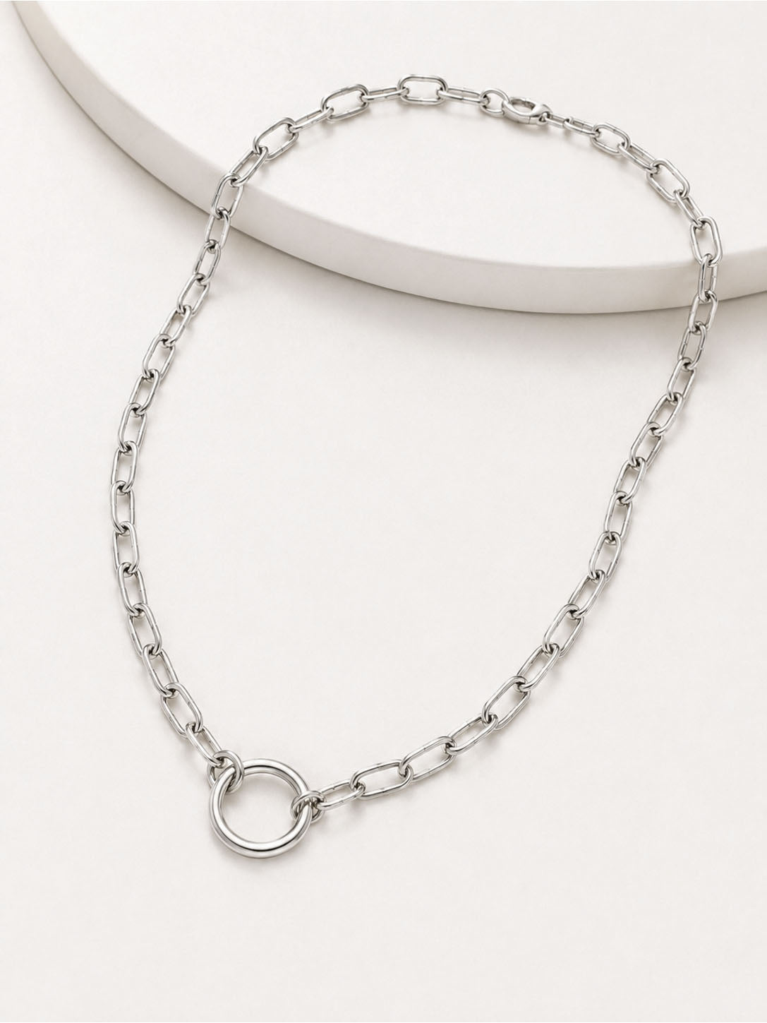 Silver chain necklace on a white background