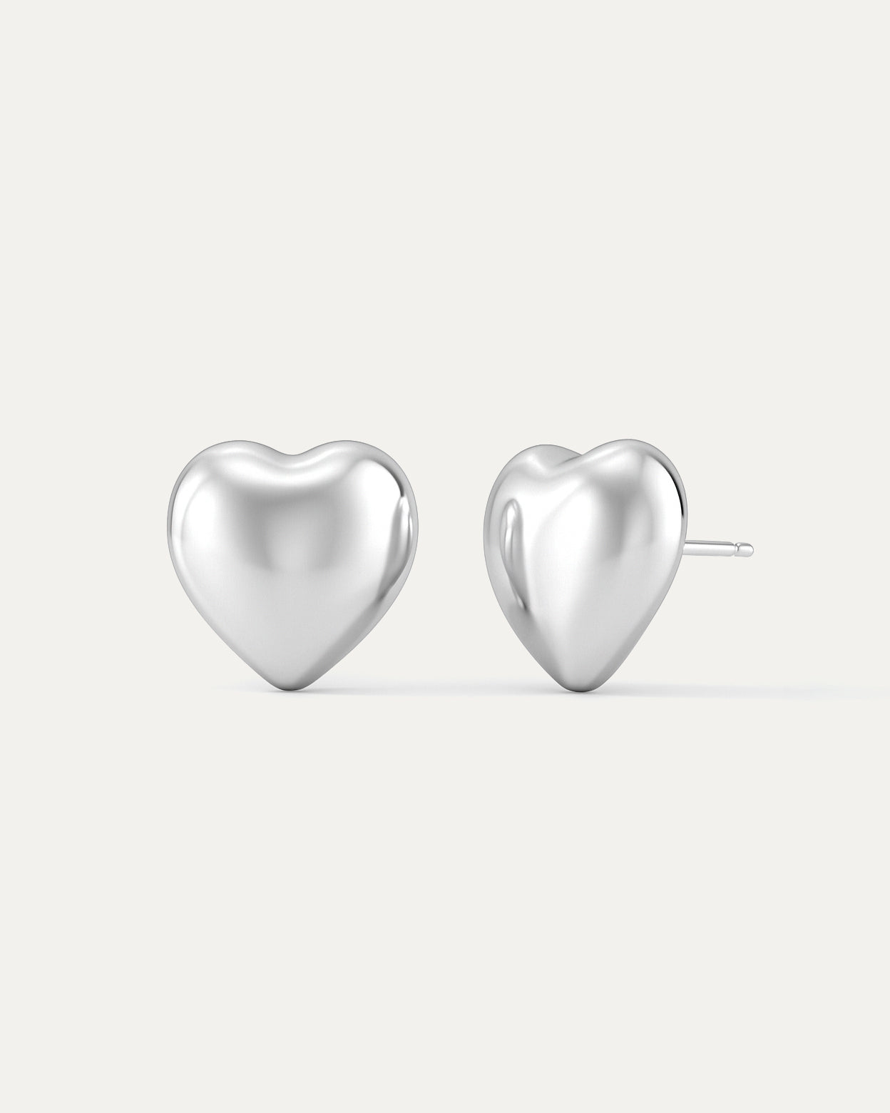 Sterling silver sculpted heart stud earrings with high-polish finish.