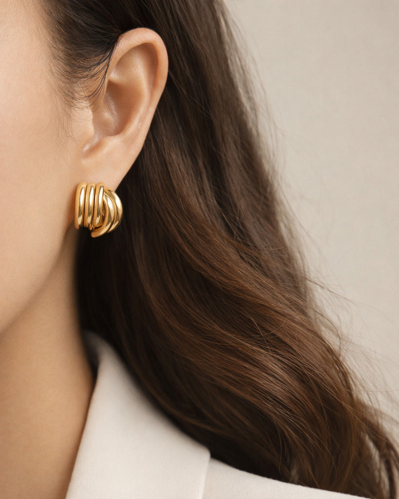 18K gold-plated semi striped stud earrings on model, minimalist women's jewelry