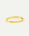 Gold bracelet on a white background