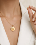 18K gold-plated star coin pendant necklace on model, minimalist jewelry style look