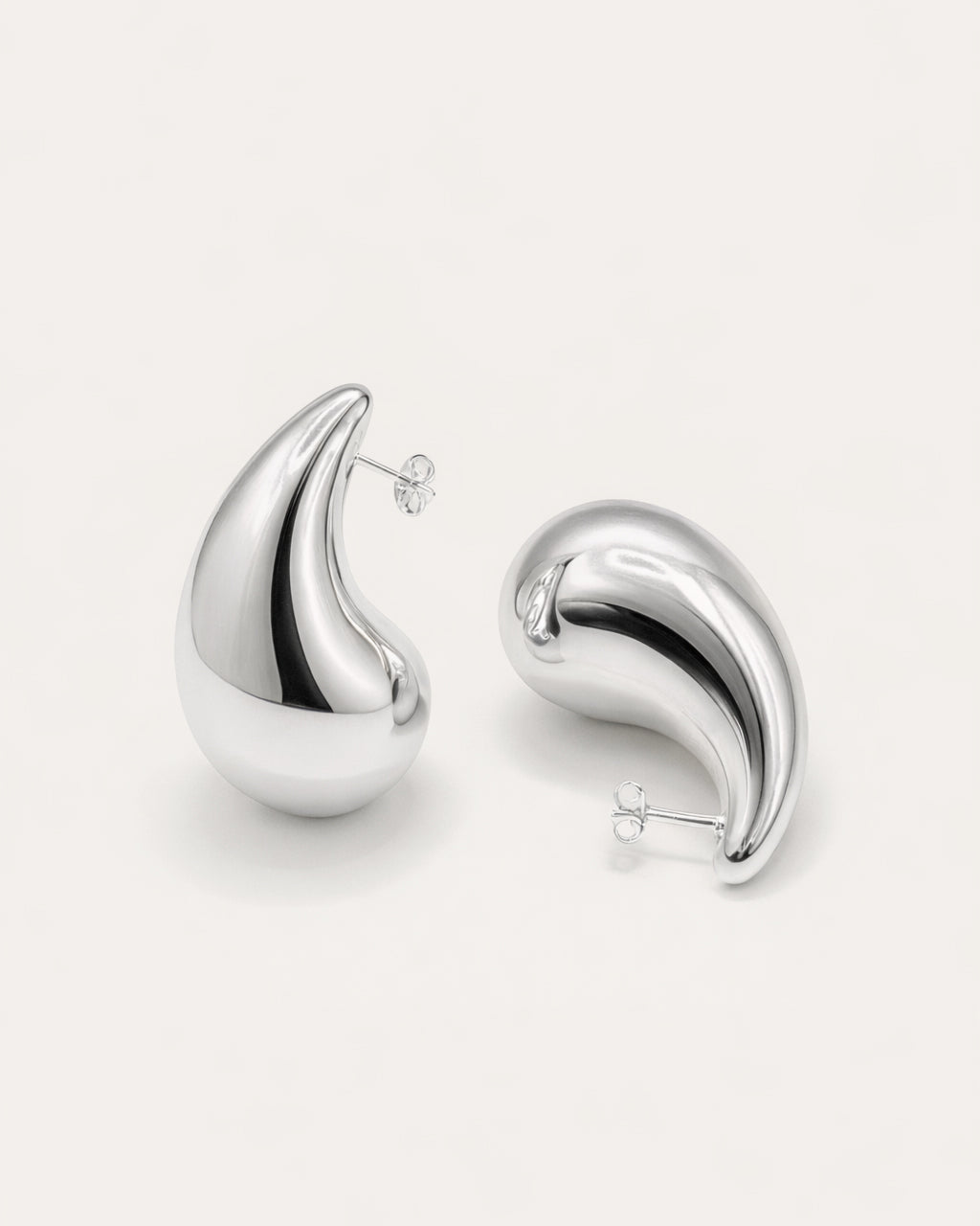 Silver-plated teardrop stud earrings top view, sculptural minimalist jewelry design