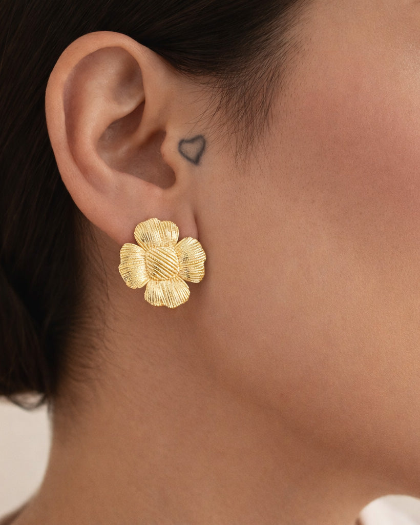 18K gold-plated floral stud earrings on model, minimalist statement jewelry
