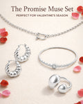 Silver jewelry set including necklace, earrings, and bracelet with Valentine's Day theme.