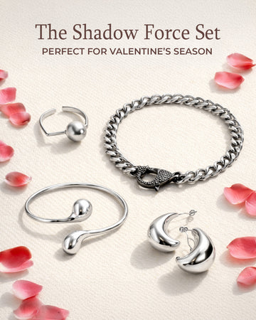 Silver jewelry set including ring, bracelet, and earrings on a beige background with pink petals.