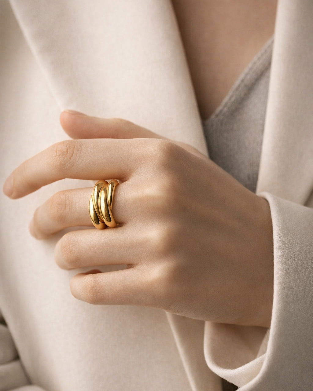 18K gold-plated triple curve bold ring on model hand, modern minimalist statement jewelry