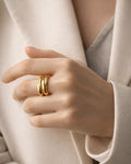 18K gold-plated triple curve bold ring on model hand, modern minimalist statement jewelry