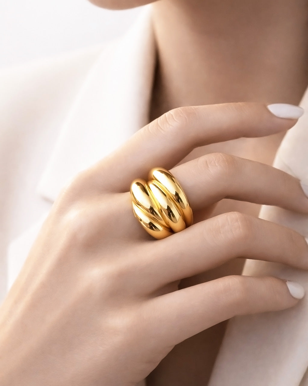 18K gold-plated triple curve bold ring on model hand, minimalist statement jewelry