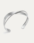 silver statement ring with layered stripe design and open adjustable back on white background