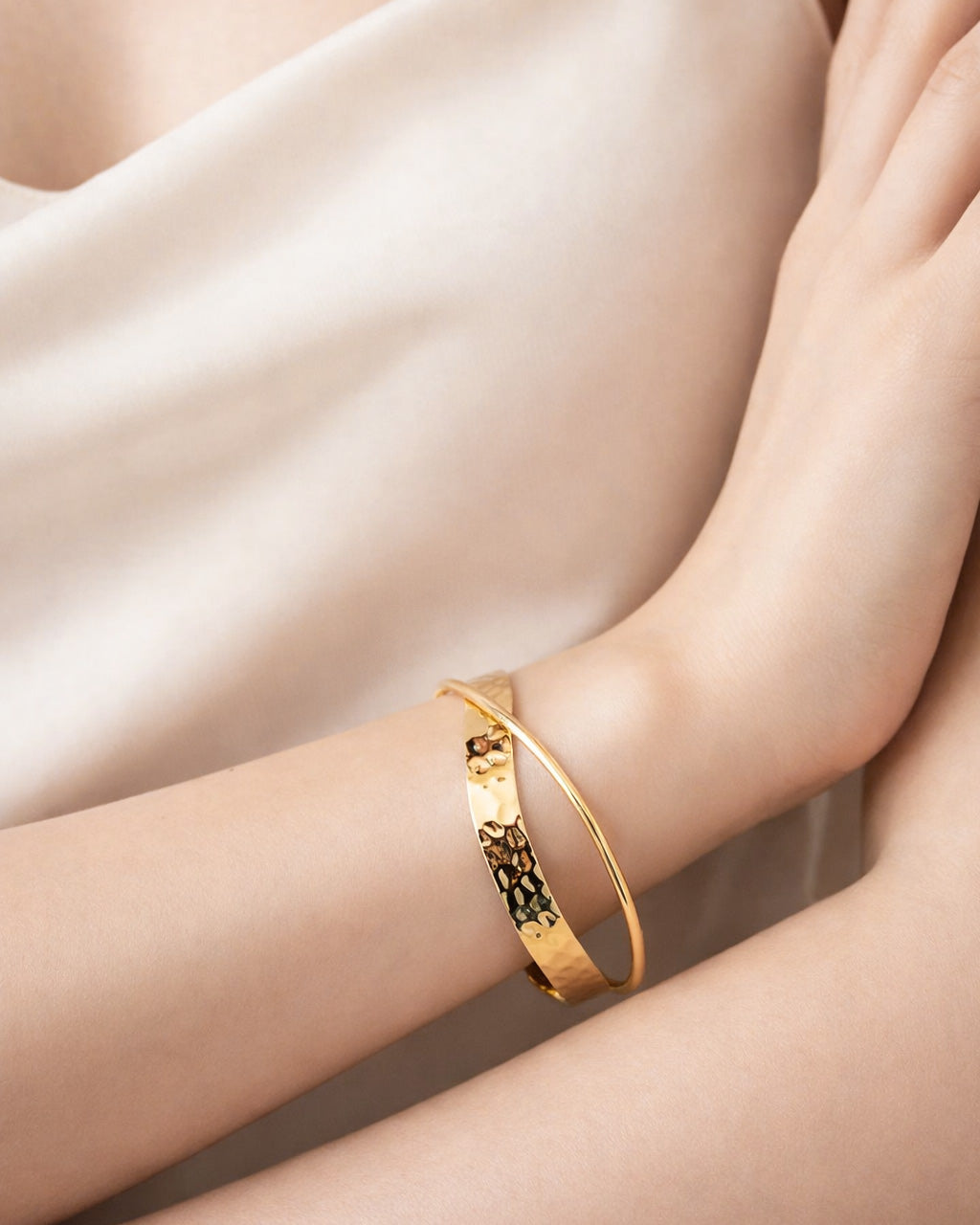 18K gold-plated hammered crossover cuff bracelet worn on wrist, minimalist jewelry