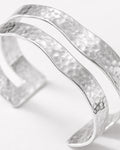 silver-plated hammered double cuff bracelet close-up, minimalist modern jewelry design