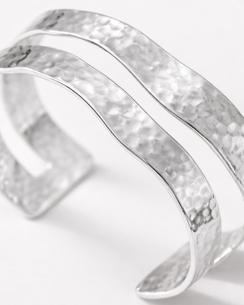 silver-plated hammered double cuff bracelet close-up, minimalist modern jewelry design