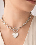 Silver-plated white heart toggle choker necklace on model, modern minimalist jewelry