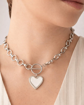 Silver-plated white heart toggle choker necklace on model, modern minimalist jewelry