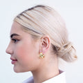 Wide gold-plated chunky hoop earrings with smooth high-polish finish and curved design