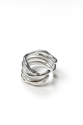organic open silver ring with sculptural branch-like design on white studio background