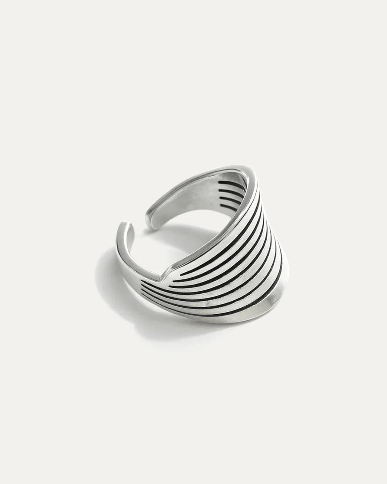 Elegant Wings of Selene silver-plated brass adjustable statement ring with engraved wing-like lines.