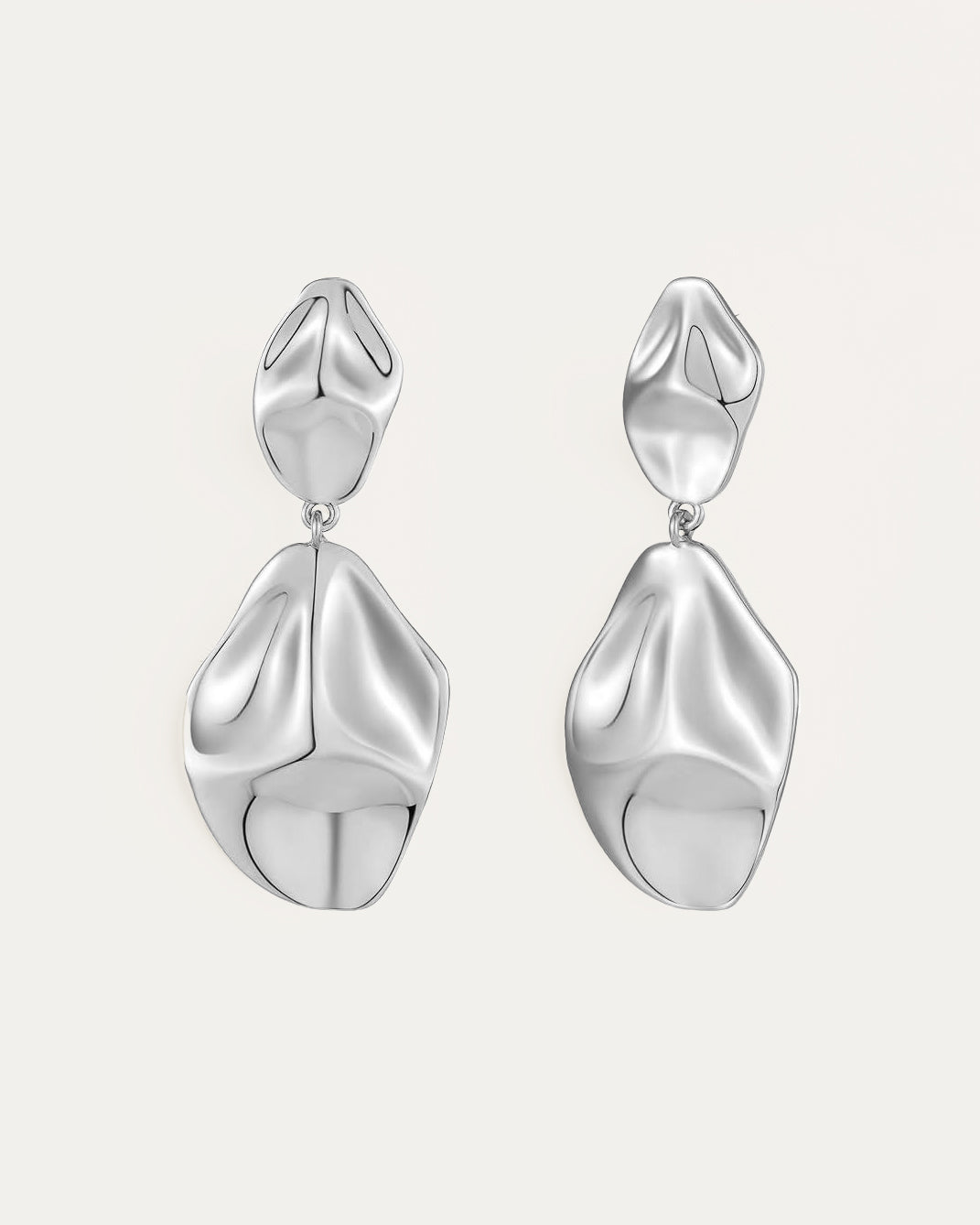 Silver dangle earrings with abstract sculptural design and fluid shape