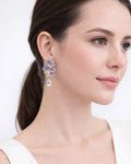 Model wearing amethyst floral drop earrings with cubic zirconia silver plated