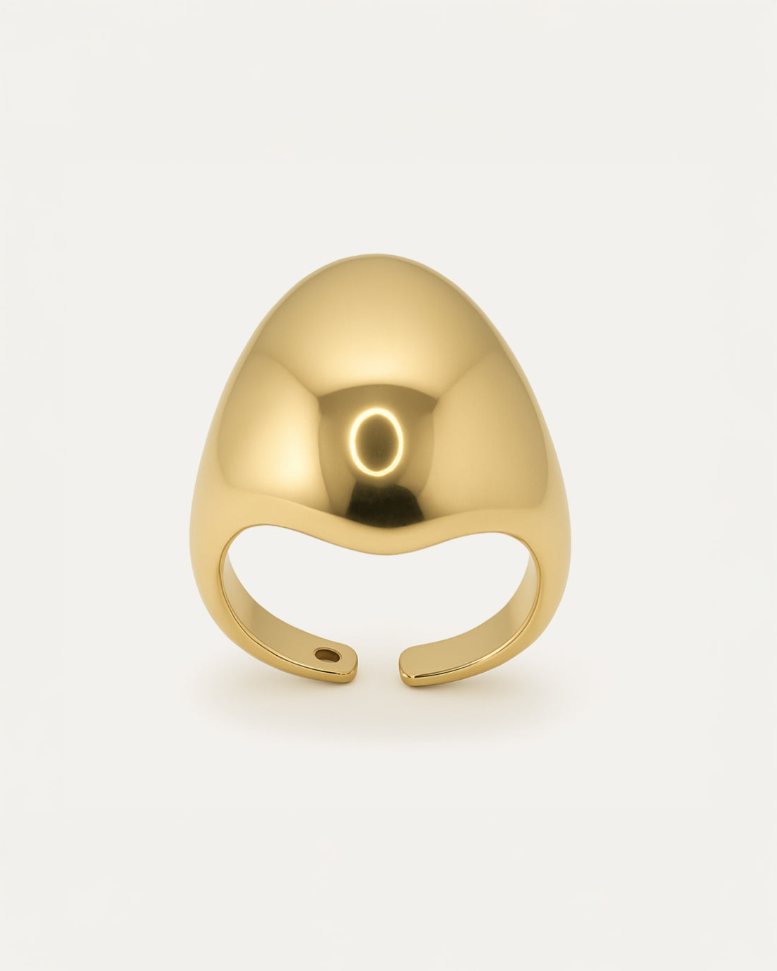 Gold statement ring with bold sculptural curved surface