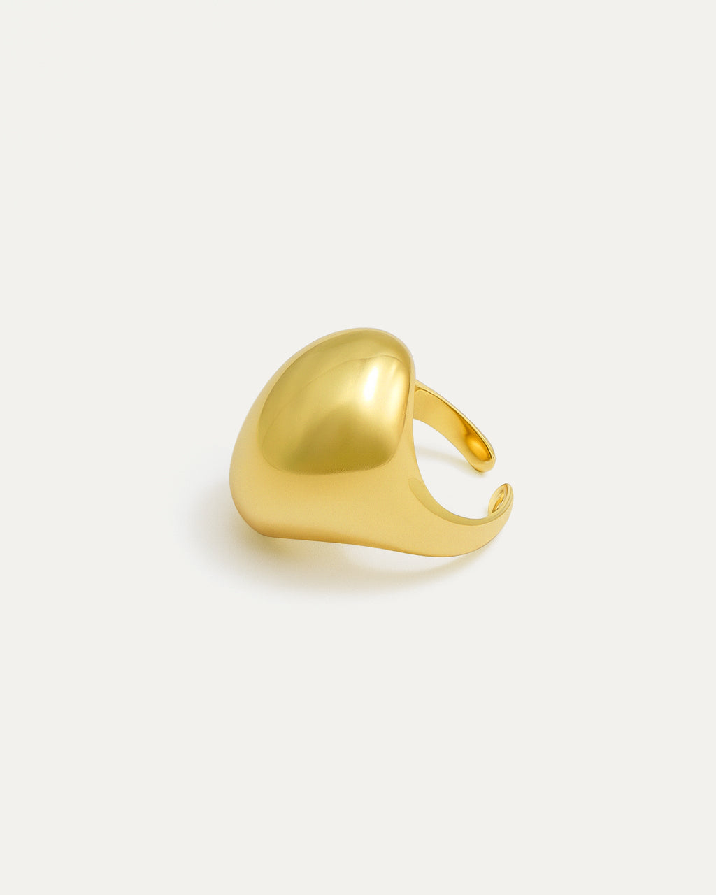 Gold statement ring with bold sculptural curved surface