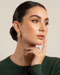 18K gold-plated baroque crescent hoop earrings worn on model with sculpted textured finish