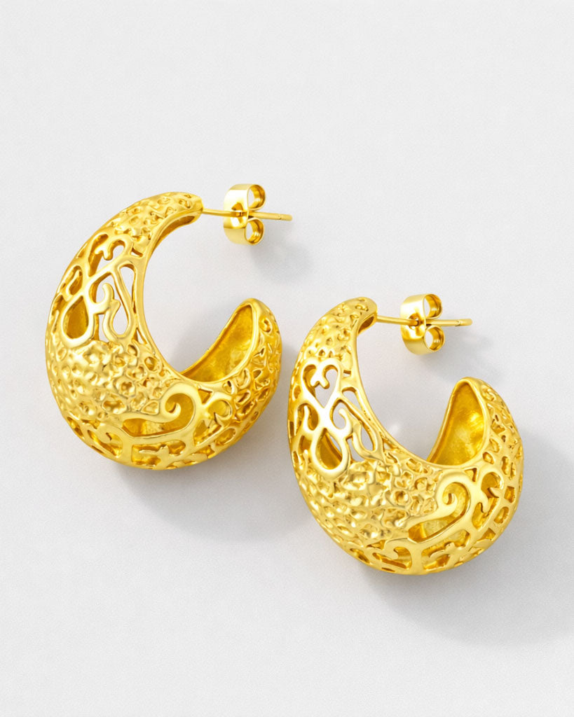 Gold-plated crescent hoop earrings with ornate baroque cutout design