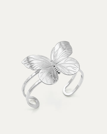 Butterfly Embrace Cuff bracelet in silver-plated brass with detailed butterfly design and open cuff structure