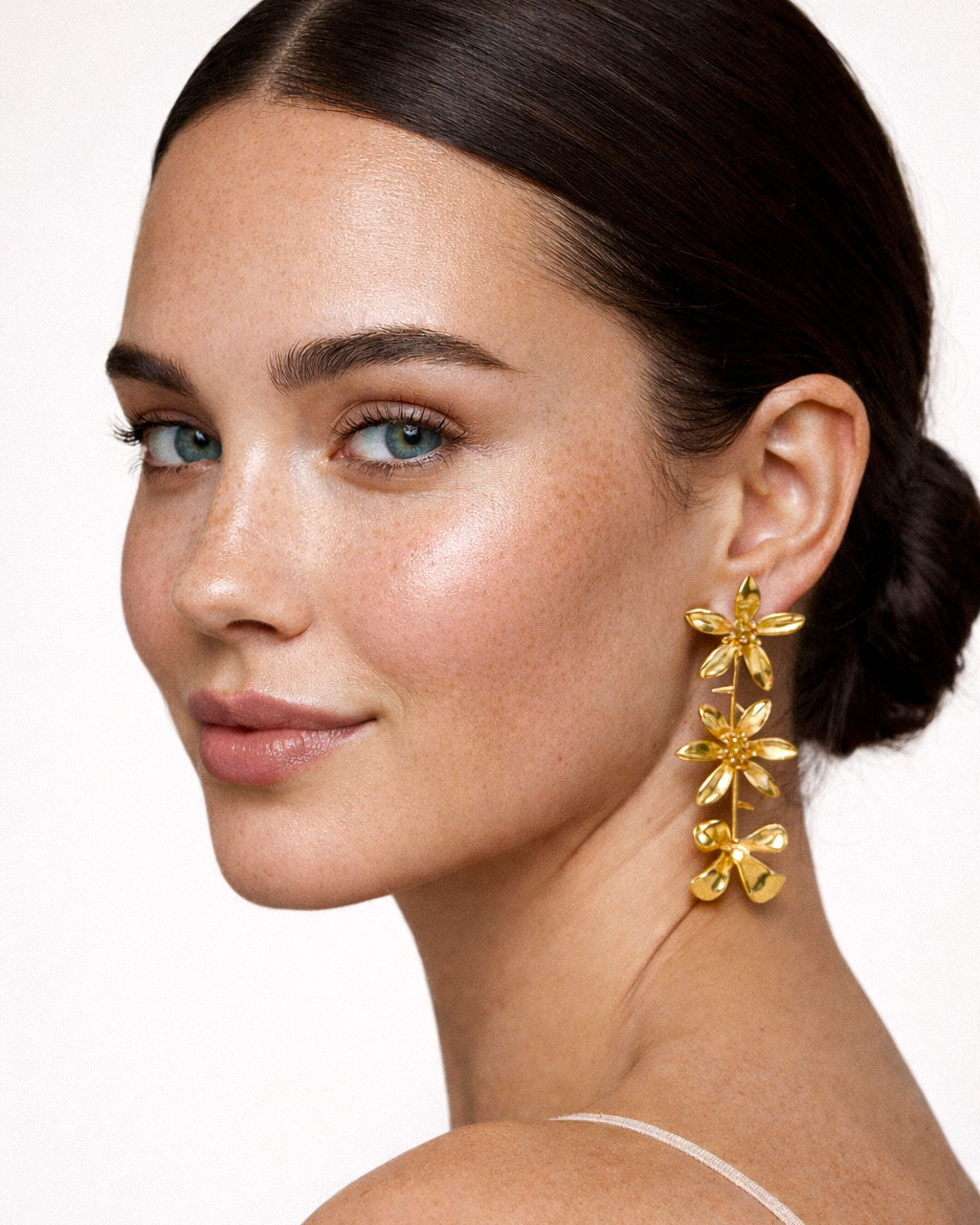 18K gold-plated cascading flower drop earrings worn by model, elegant floral statement earrings for women