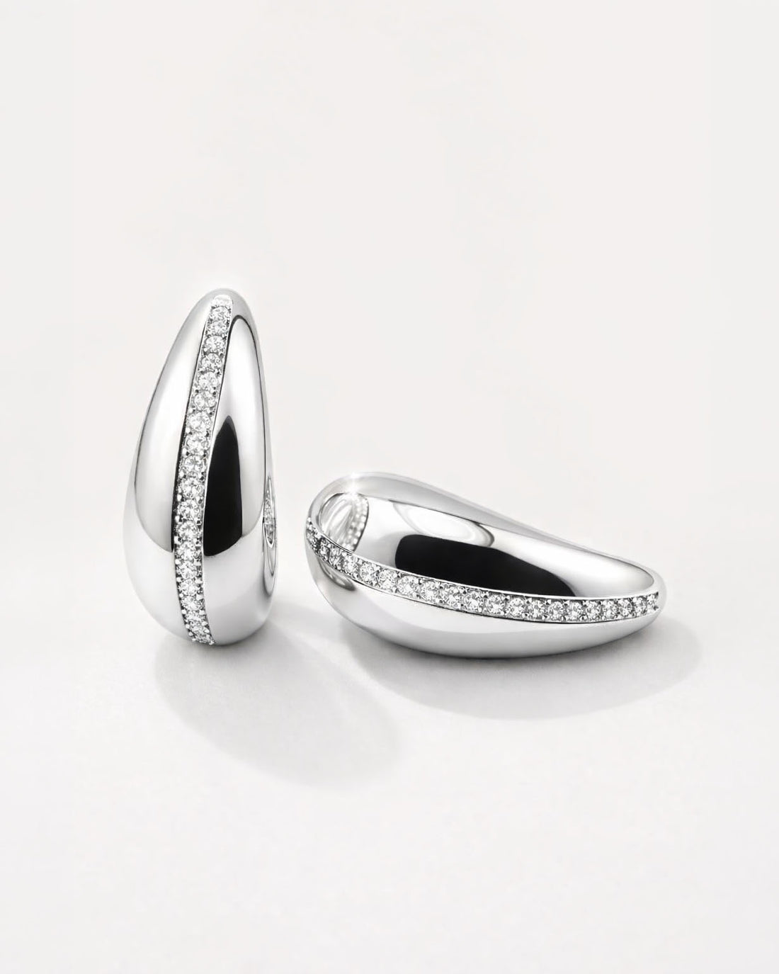Celeste Arc Studs in silverplated brass with sleek crescent arc design