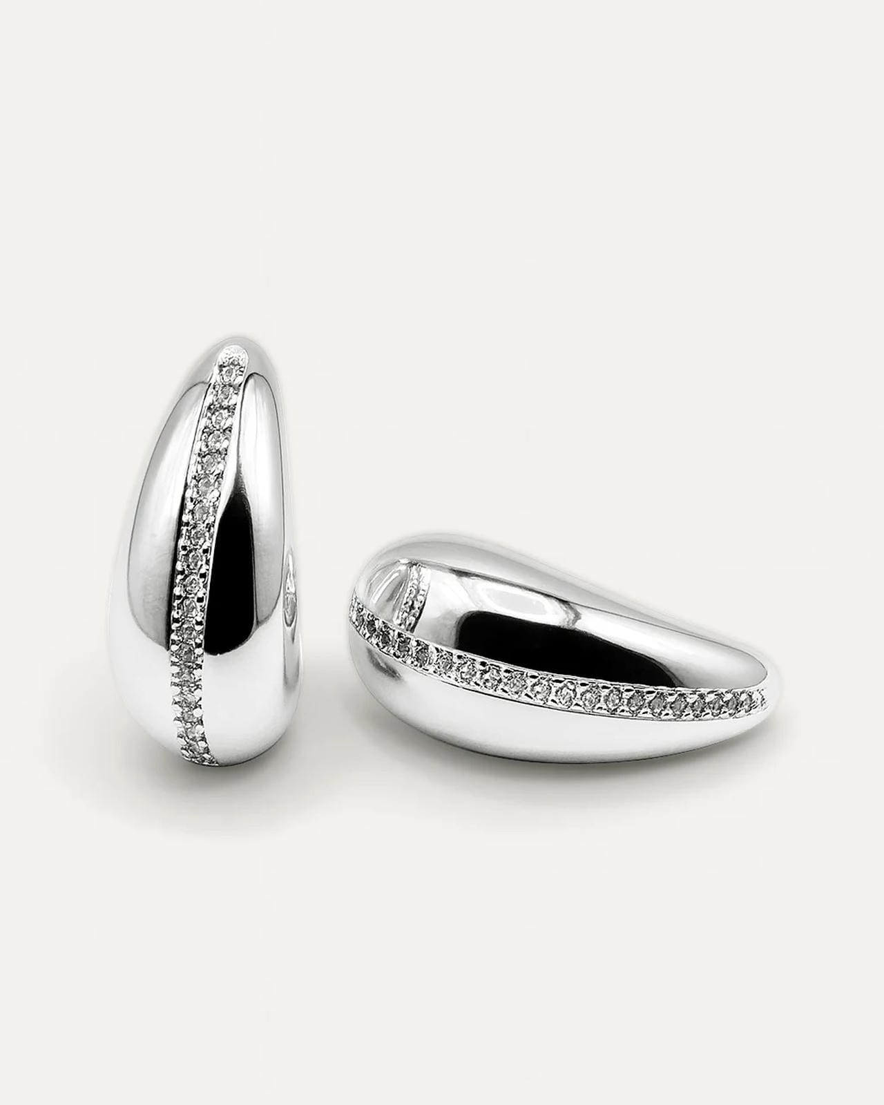 Celeste Arc Studs in silverplated brass with sleek crescent arc design