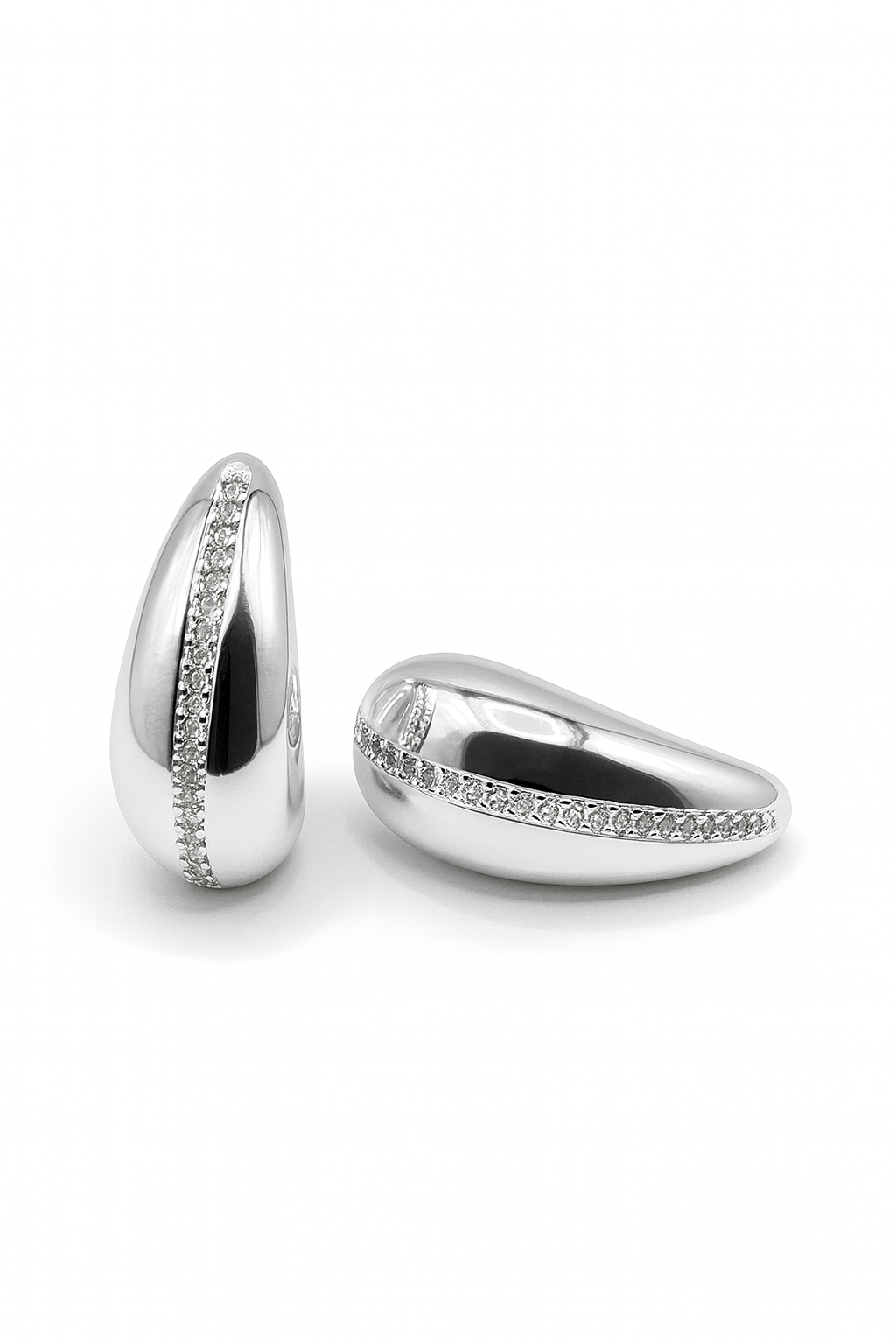 Celeste Arc Studs in silverplated brass with sleek crescent arc design