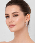 Silver star hoop earrings on ear with crystal detail minimalist jewelry