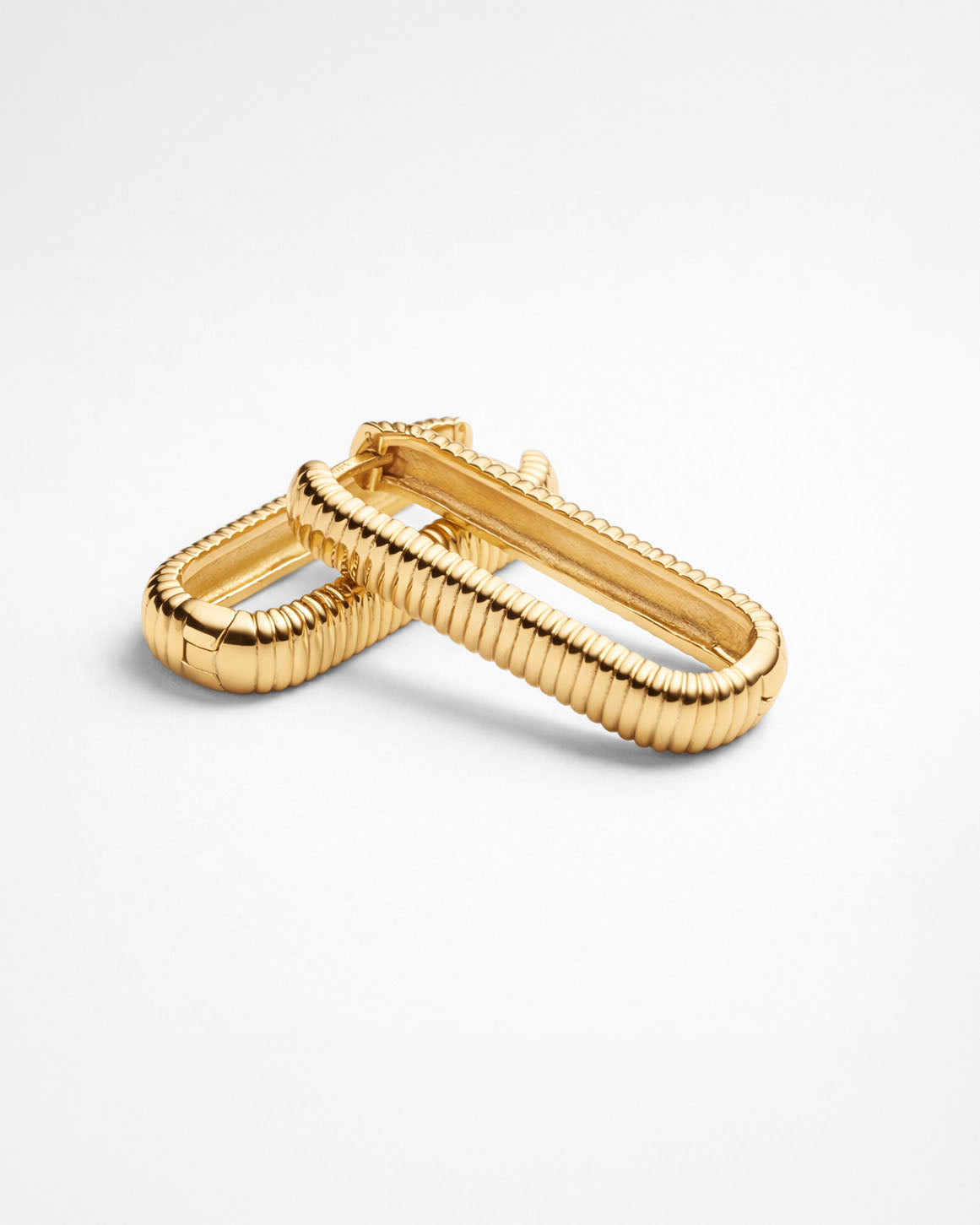 Gold rectangular hoop earrings chunky textured design minimalist flat lay