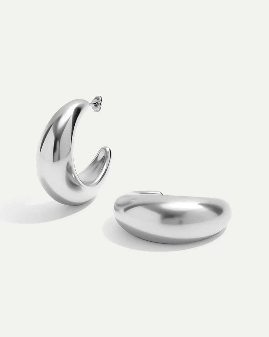 Silver hoop earrings on a white background