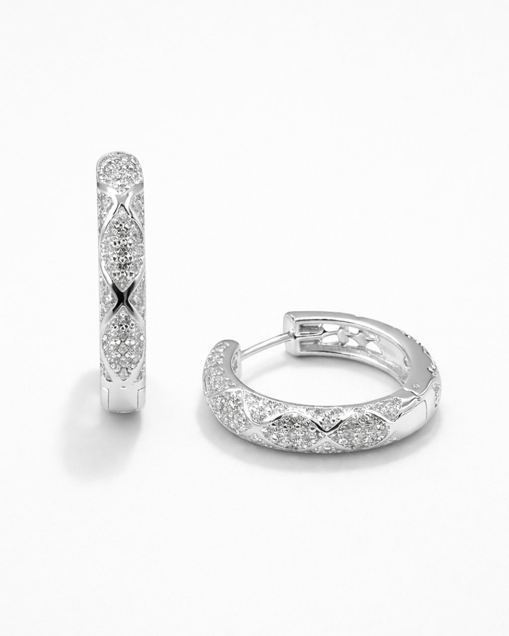 Silver pavé hoop earrings with diamond-like detailing and polished silver finish