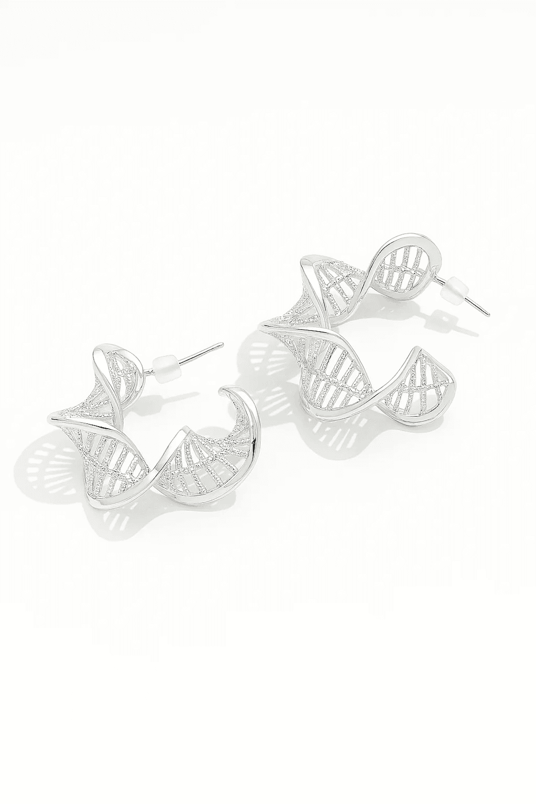 Silver hoop earrings on a white background