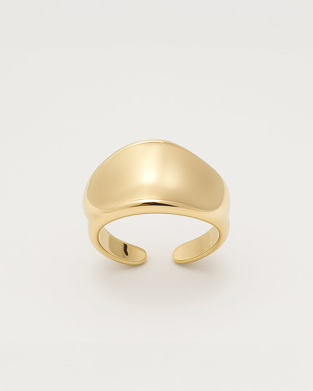 Gold open statement ring with a smooth domed curve and minimal design