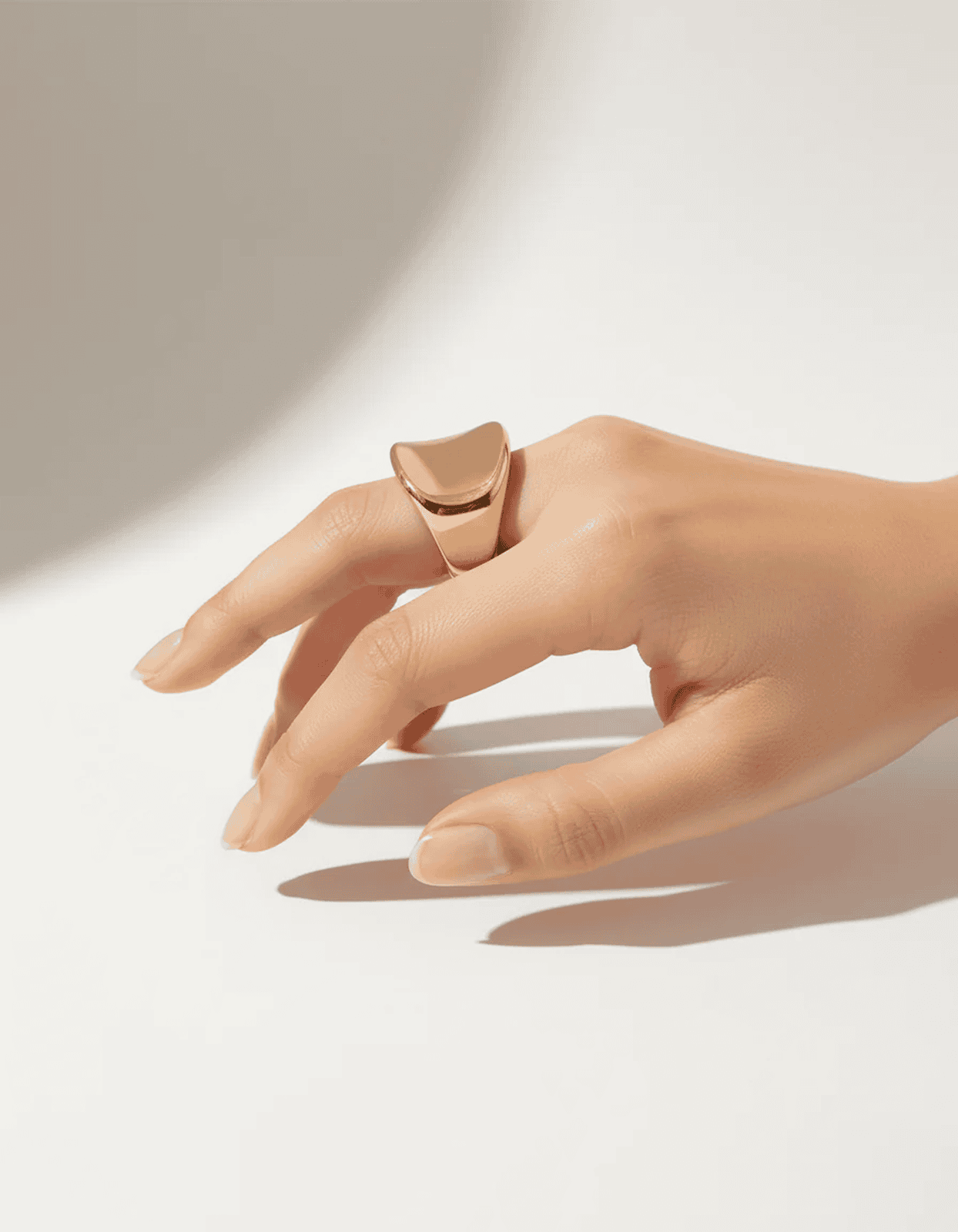 Gold open statement ring with a smooth domed curve and minimal design