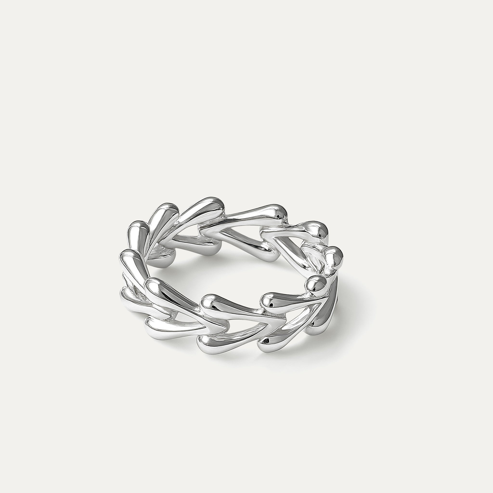 delicate silver ring with teardrop vine design on white background