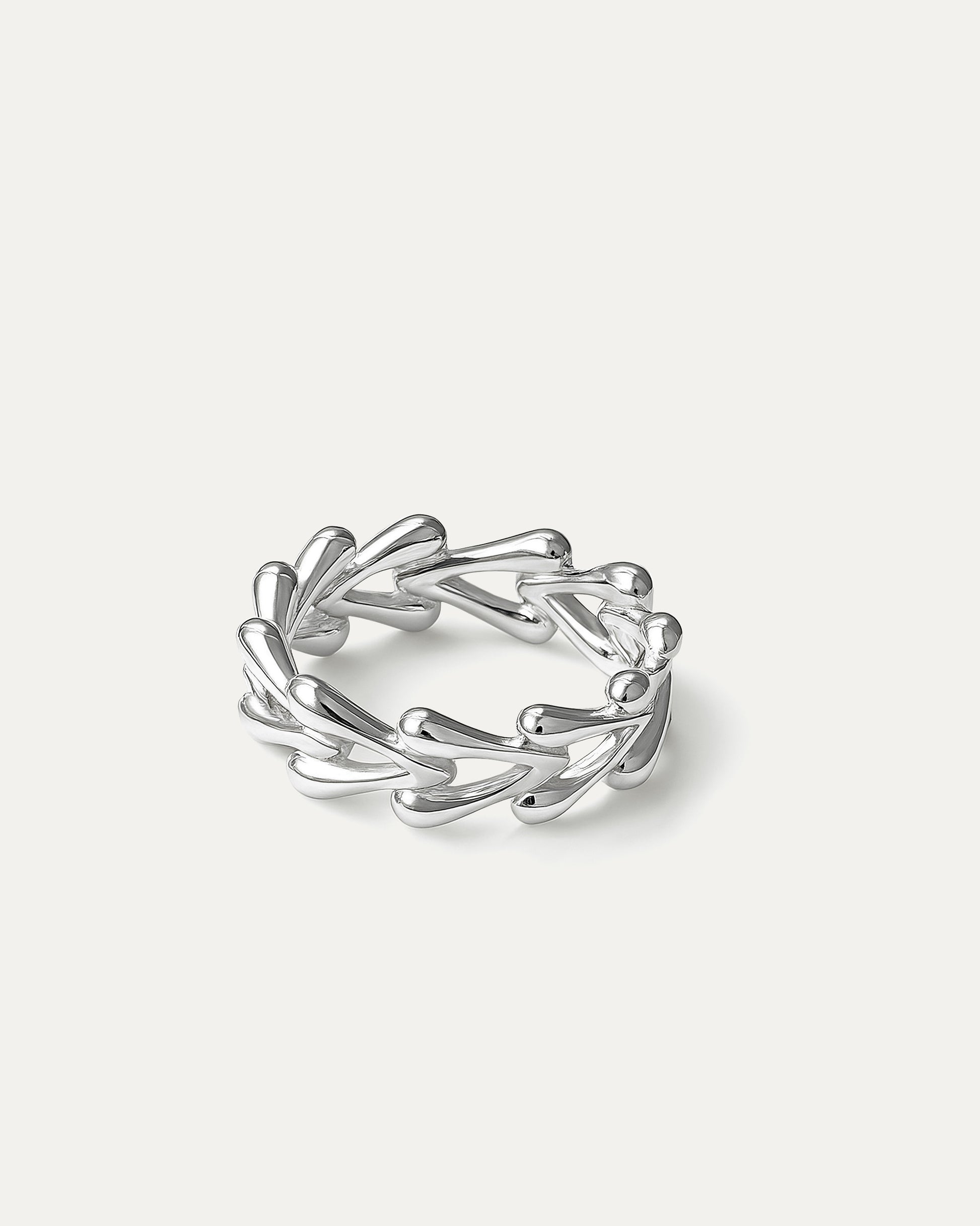 delicate silver ring with teardrop vine design on white background